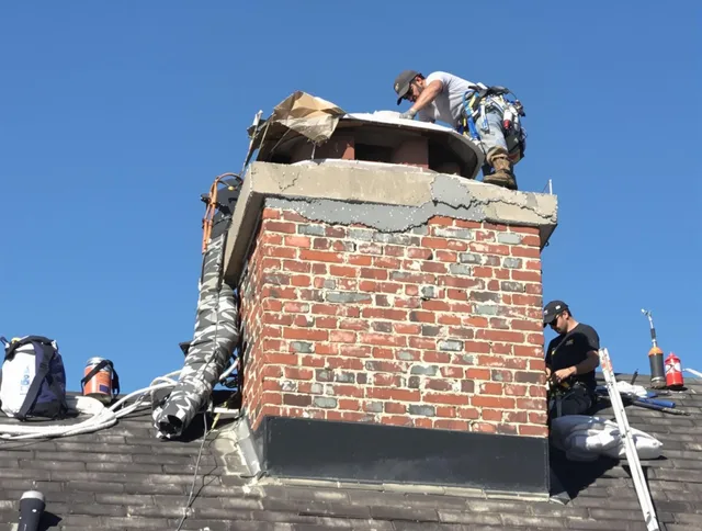 Winchester Chimney Sweep installing a custom chimney crown in Winchester, CT