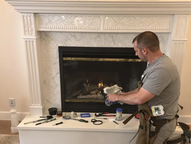 Winchester Chimney Sweep performing fireplace maintenance in Winchester, CT