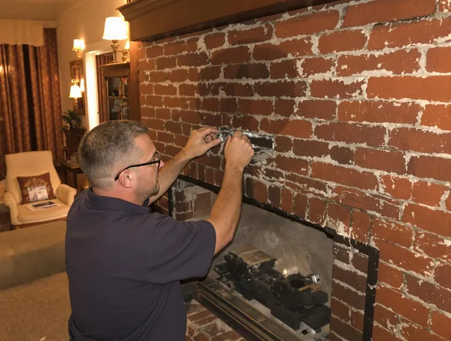 Winchester Chimney Sweep expert fixing a fireplace in Winchester, CT